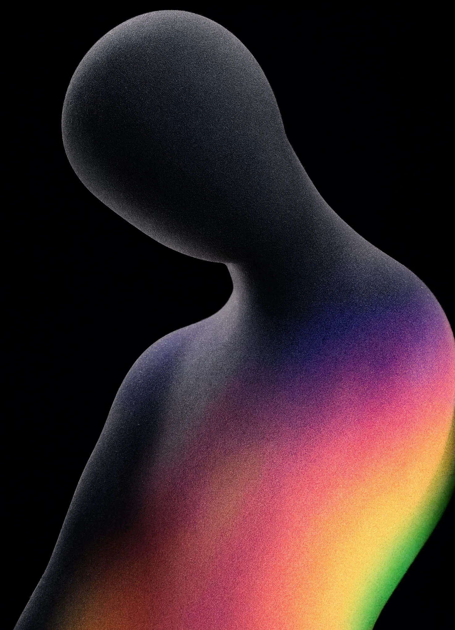 A smooth dark figure turning away into black, its shoulder and back catching a grainy rainbow of color