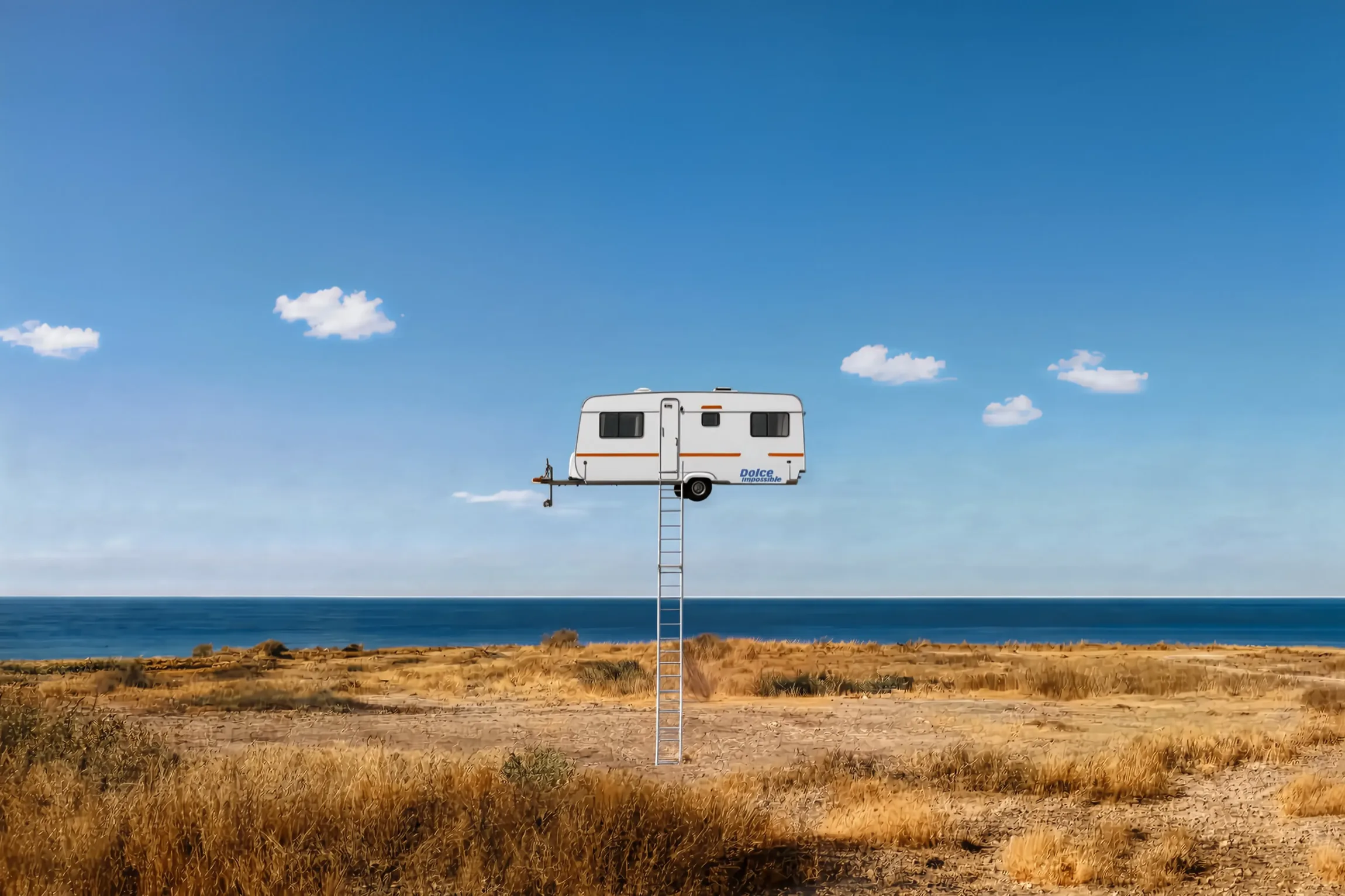 A caravan perched at the top of a tall ladder in a coastal scrub field, the sea behind it
